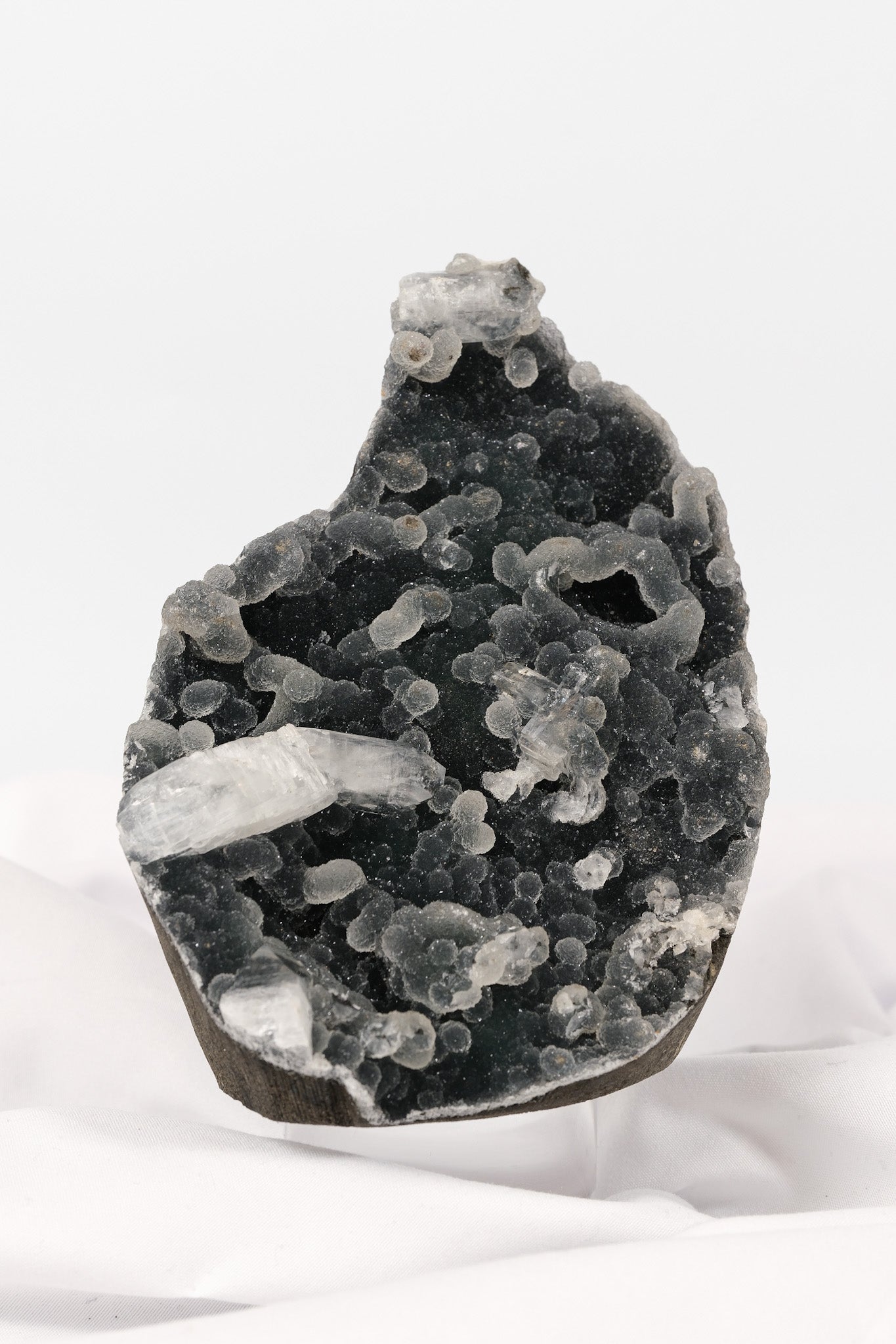 Botryoidal Apophyllite on Black Chalcedony Cutbase
