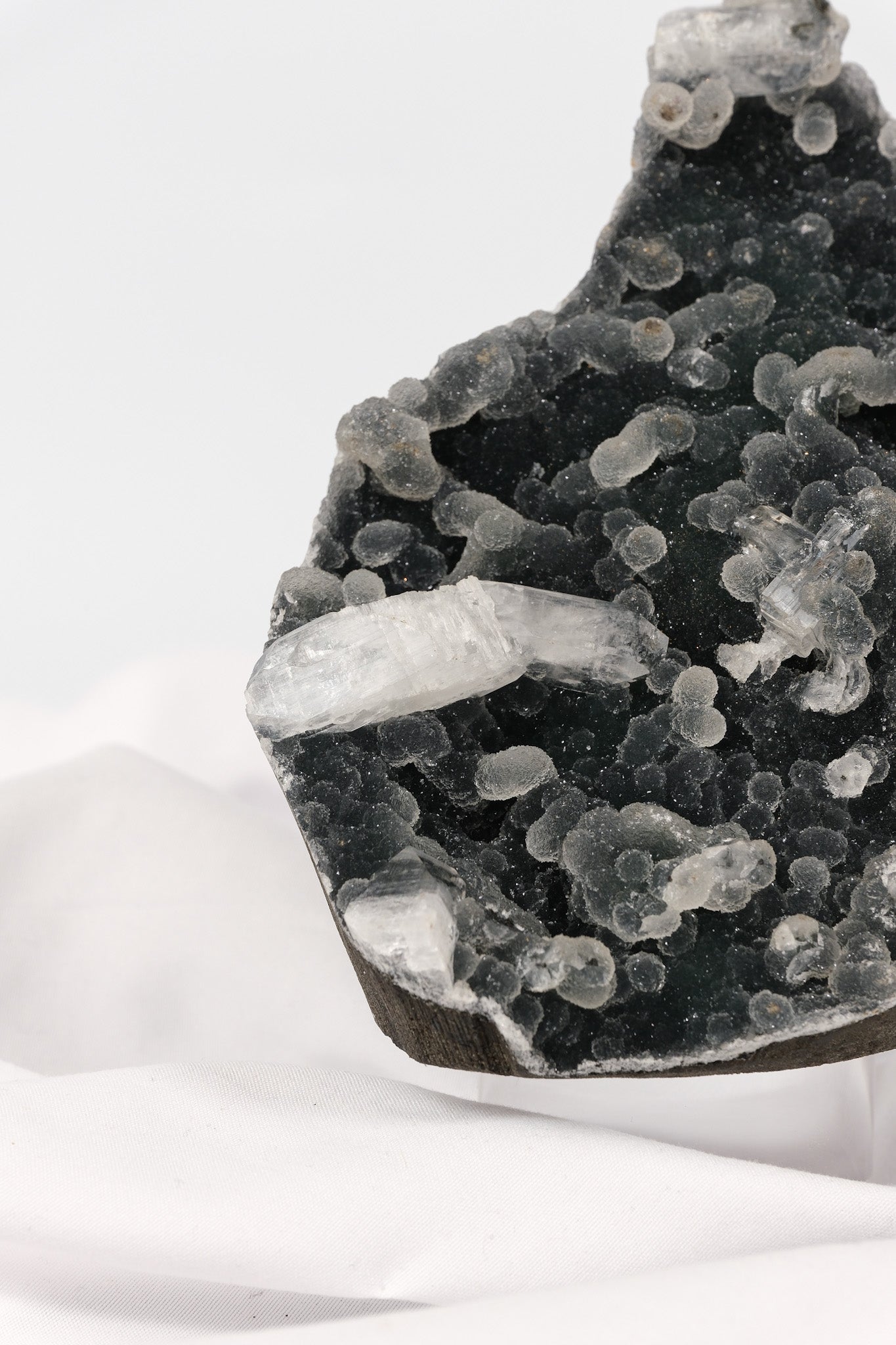 Botryoidal Apophyllite on Black Chalcedony Cutbase